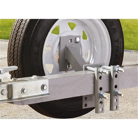 Step-by-step guide: how to change a flat tire on your Magic tilt trailer using the spare tire holder.